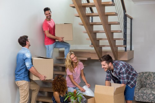Moving team preparing furniture safely during a Harringay van service