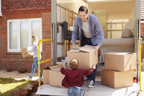 Moving team handling flat removals in Harringay near apartment entrance