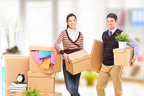 Professional movers handling office furniture in Harringay