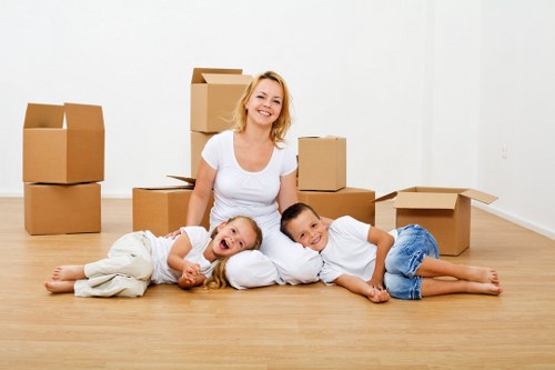 Removal team handling boxes and furniture carefully