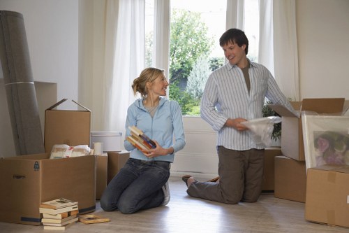 Unpacked moving boxes and furniture in a new Harringay home