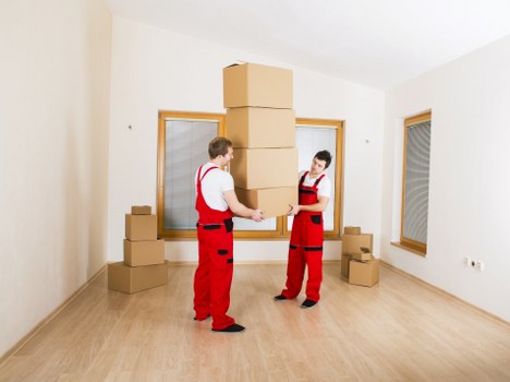 Trained movers handling items carefully with PPE