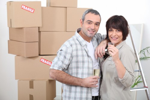 Packed office boxes and labeled equipment for relocation