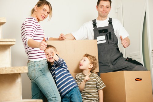 Movers unloading boxes at a Harringay property